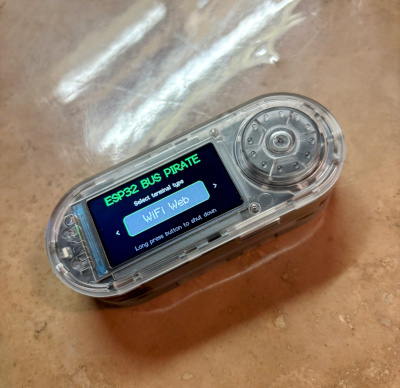 A photo of the ESP32 Bus Pirate firmware running on Lilygo device